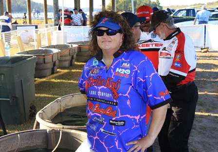 Pro Kathy Crowder waits at the tank to get an official weight. More and more women are enjoying the sport of competitive bass fishing.