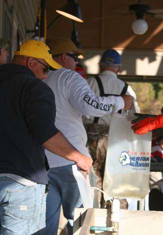 A few anglers wait at the holding tanks prior to weighing their fish at the Toyota Tundra Weekend Series Championship.
