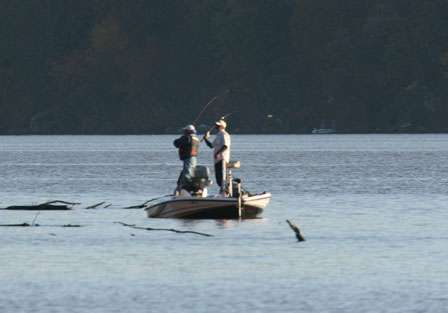 Boater and non-boater make a last-minute cast along a series of laydowns near the Lake Dardanelle State Park.