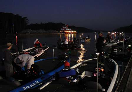 Boats start to gather at the dock to keep from fighting current as the anglers make last minute preparations.