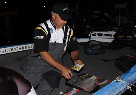 Pro John Cromwell sorts through baits as he narrows his choices for Day Two.