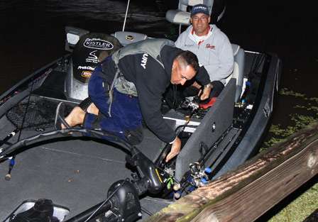 Jeremy Montoyo digs through his rods making selections for Day Two as his co-angler for the day Charles Poland cuts up.