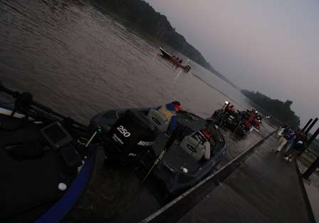 The final day of the third and final Bassmaster Central Open gets under way as pro Mark Smith pulls away from the dock.