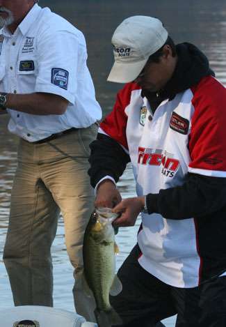 Hojin Chang puts his first keeper of the day in the boat, a solid 3-pound largemouth.