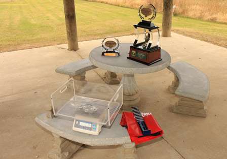 As a small crowd starts to gather nearby, the tools that will determine the outcome of the tournament sit on a small table under a park pavilion.