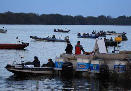Competitors idle past the release boats where BASS officials carry out the final inspections before allowing competitors out onto the lake.