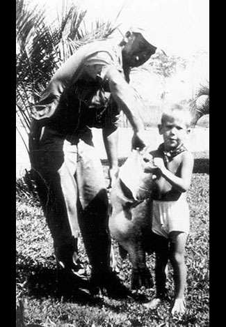 There are no known photos of Perry's record largemouth, but this might just be a shot of fishing's most famous bass. The man holding the fish is not Perry, but the backdrop appears to be the South Georgia town where Perry weighed the bass.