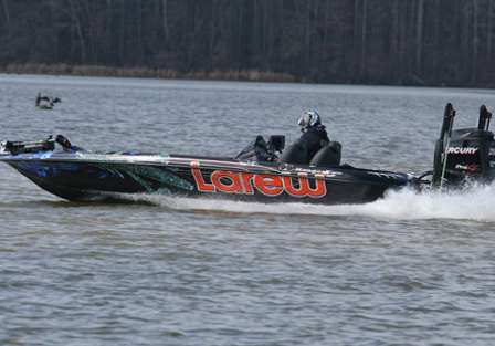 Tommy Biffle is hard to recognize in his mask as he stays warm on the cold trip across Lay Lake.