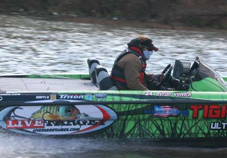 After graphing an area of the lake, Byron Velvick raises his facemask to head down the lake.
