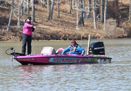 Elite pro Kevin Short points to shad that were floating up around his boat.