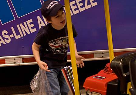 Camden Sanders, 5, from Tuscaloosa, Ala., looks excited to find a go-kart at the STA-BIL booth.
