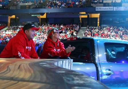 The Mercury crew watches the weigh-in from the bed of a Toyota Tundra truck.