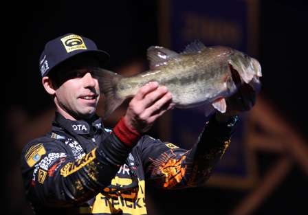 Mike Iaconelli holds the biggest bass of the day, a 6-pound, 10-ounce largemouth.