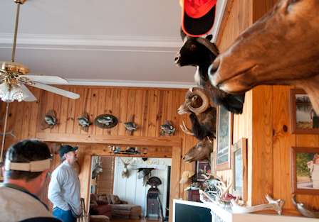 Country music star Darryl Worley admires some trophies prior to his day of fishing. 