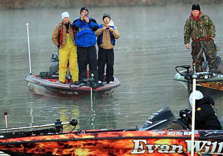 Spectators and media  use boats to follow their favorite anglers.