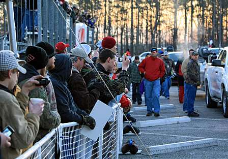 Fans pack in along the ramp hoping to see their favorite anglers.