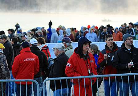 Spectators brave cold weather to see the anglers launch their boats.