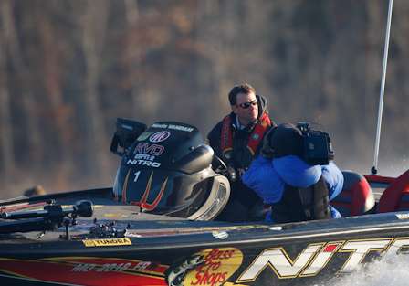 The first round leader, Kevin VanDam, takes off as his cameraman records the action.