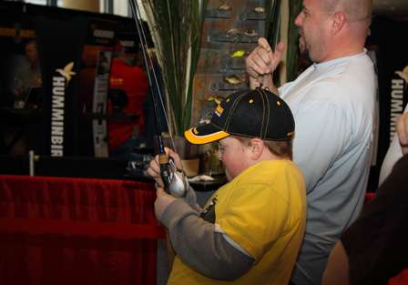 Expo visitors fight with a fishing game at the 2010 Bassmaster Classic Expo.