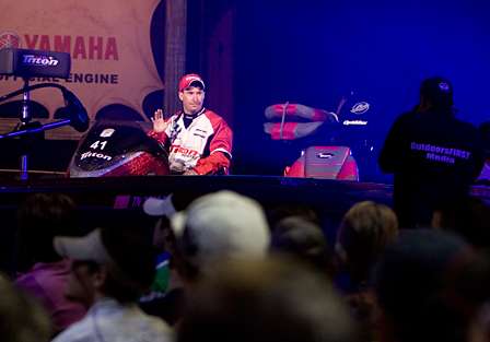 Federation Nation angler Randy Phillips waves to fans as he enters the arena.