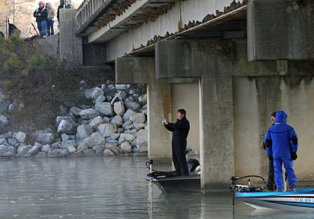 Most of the spectator boats stay under or behind the bridge where VanDam is fishing.