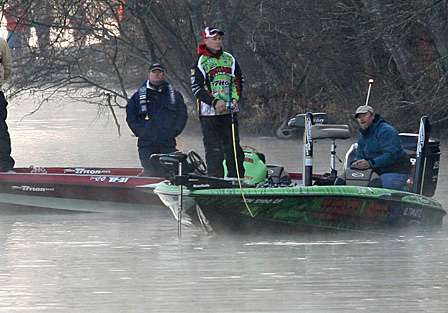 Brent Chapman is fishing among the spectators around VanDam on the other side of the bridge.