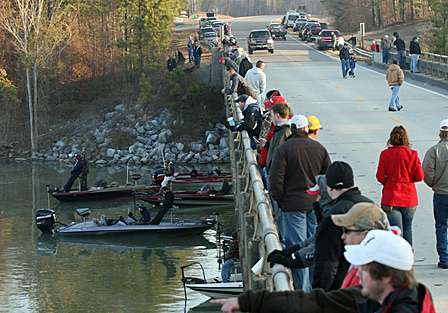There are twice as many fans watching from the bank as there are on the water.