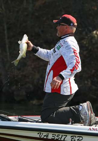 Freeman gets a strong grip on a spotted bass. 