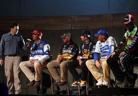 Keith Alan talks to Todd Faircloth as the Super Six anglers wait on stage to weigh in.
