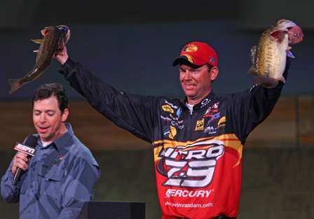 VanDam shows the crowd two of his winning fish. 