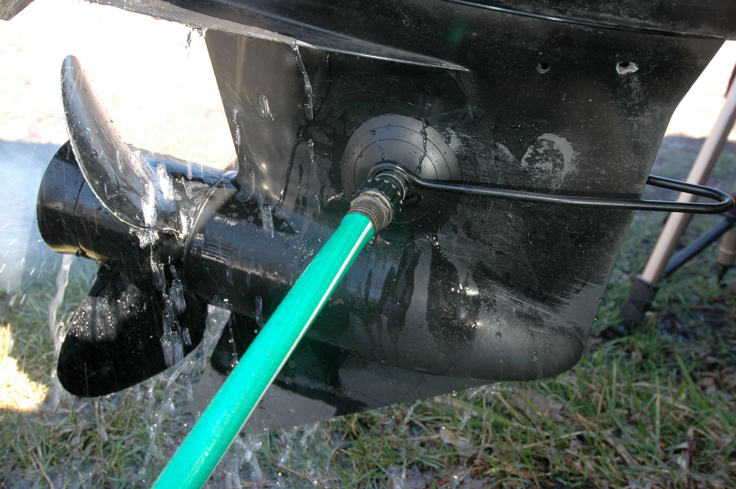 Connect muffs to a water hose. Start the engine, and let it warm up prior to the compression test. While the engine is running, see if the outboard shifts smoothly into forward and reverse.