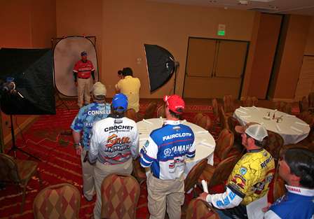 Anglers stand in line to have photos taken that will be used for Bassmaster media.