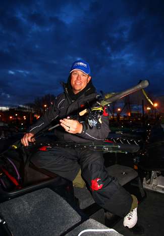 As cloudy skies beckon overhead, Russ Lane pulls a few rods out of the rod locker.