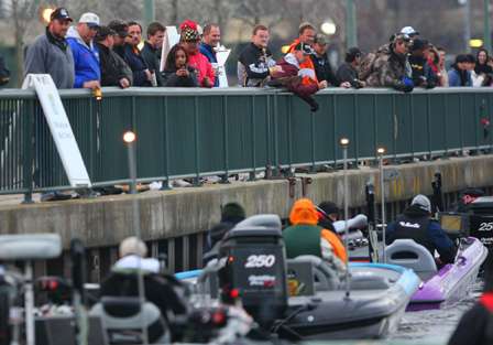 Boats and fans alike line up along the wall to watch take-off for the TroKar Duel in the Delta.