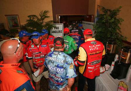 Anglers line up to enter the meeting room where the tournament briefing will begin.