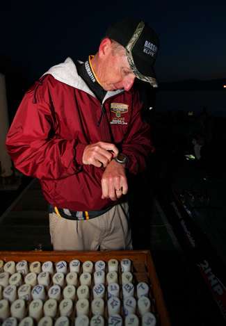 Trip Weldon looks at his watch and prepares to move the anglers through the take-off line.