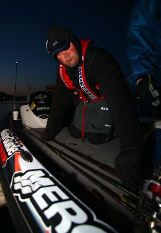 Greg Hackney straps down a few rods that he will use during his day on Clear Lake.