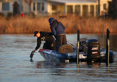 Bradley Roy reaches down to lip-land a Clear Lake bass on Day One of the Golden State Shootout.