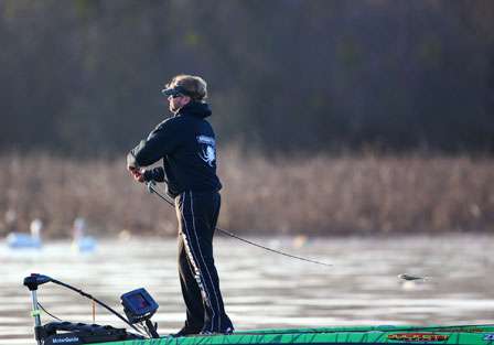 Byron Velvick winds back and hurls a bait across the lake early in the day.