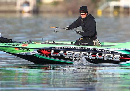 Elite Series rookie Scott Ashmore fights a bass to the side of the boat.