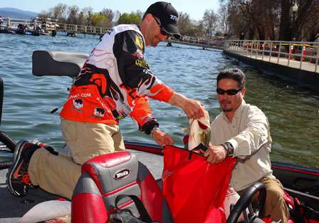 Randy Howell bags his fish and prepares to weigh in his catch in Lakeport, Calif.
