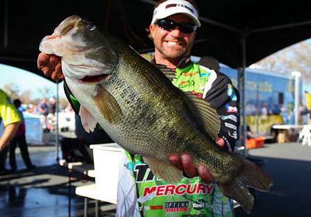 Byron Velvick holds up the biggest bass caught on the 2010 Elite Series before he brings her to the scales.