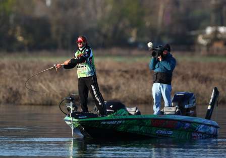 Day One leader Byron Velvick winds up to make a cast as the ESPN cameras capture the action.