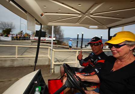 Grant Goldbeck gives a thumbs up as he is chauffeured to the weigh-in on a golf cart.