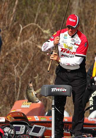 Eaker boat flips another bass as he works on making a charge at the Day Three lead.
