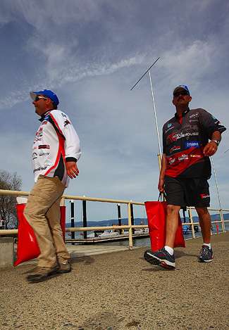 Pat Golden and Jared Lintner walk to the weigh-in carrying their fish on Day Three of the Golden State Shootout.