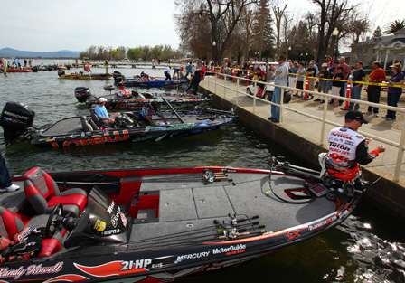 Randy Howell and the rest of the Day Three competitors line up along a sea wall in Lakeport, Calif., to weigh in their catch.