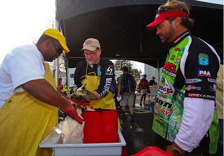 Tournament leader Byron Velvick checks his catch at the bump station before getting in line to weigh in.