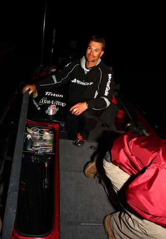 Randy Howell opens his rod locker early Sunday morning on Clear Lake.