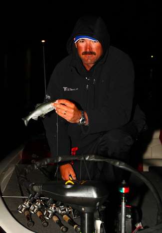 Jared Lintner holds up a big swimbait that he plans on using Sunday.
